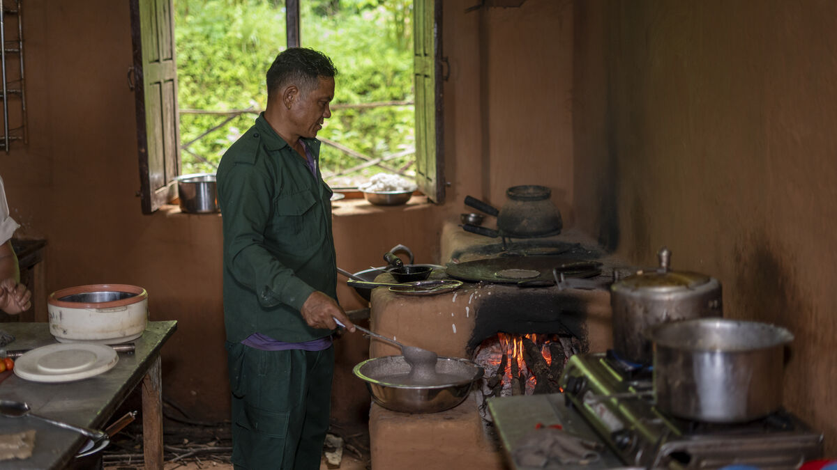 Cooking a traditional meal over the wood fire
